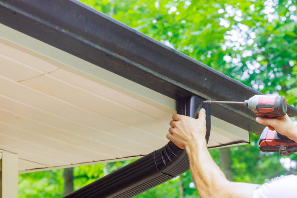 istock Assembling installing gutter channels on roof of a home 2172651996