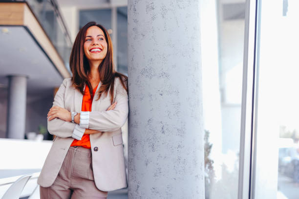 istock Smiling businesswoman posing in modern office 2172654295