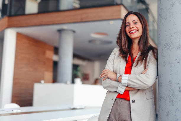 istock Smiling businesswoman posing in modern office 2172654302