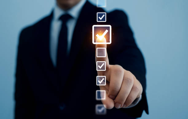 istock Person checking list quality and counter product approval the correct selection boxes.Productivity checklist,filling survey form online,fast checklist and clipboard task business management. 2172665440