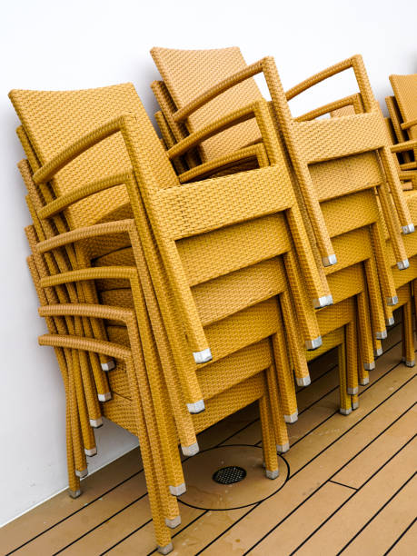 istock Stack of yellow braided plastic relax chairs with metal legs on cruise ship board deck 2172670084