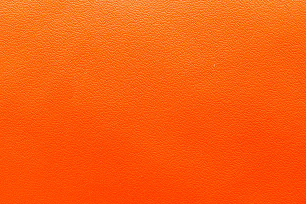 istock A vibrant orange leather texture suitable for backgrounds, design projects, and artistic creations. 2172670536