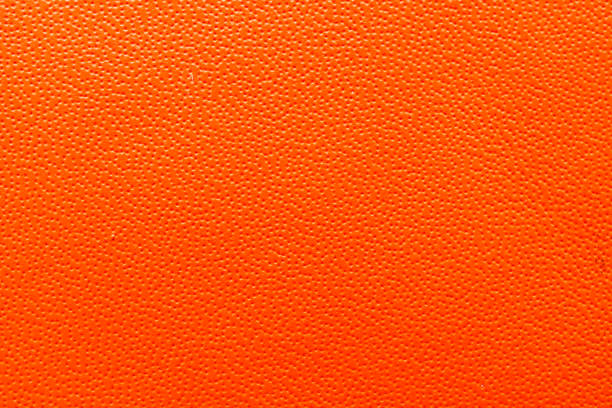 istock Close-up of vibrant orange texture, perfect for backgrounds, design projects, and creative applications. 2172670579