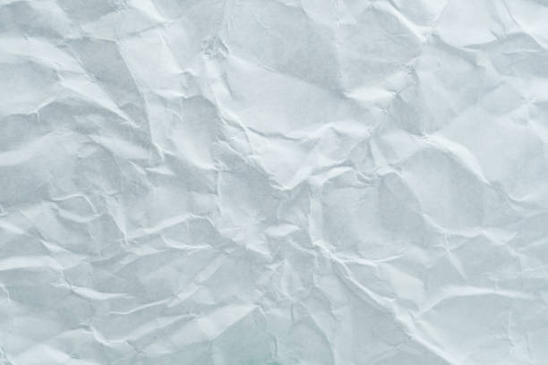 istock Crumpled white paper texture with soft shadows and light creases, perfect for backgrounds or abstract designs in various projects. 2172670602