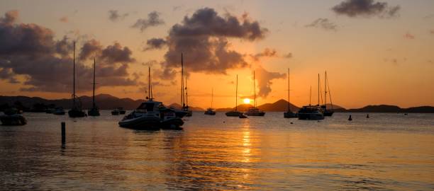 istock Serene sunset over a harbor with sailboats and yachts. 2172681259