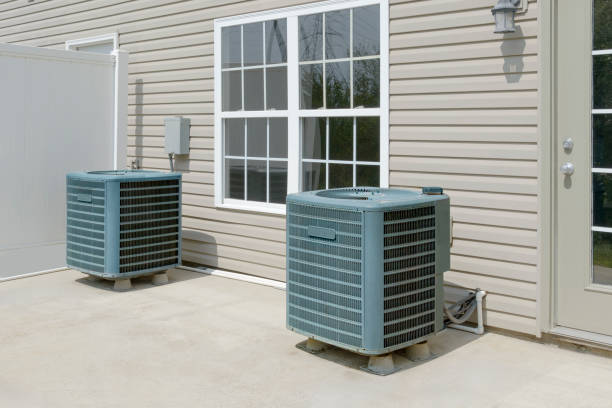 istock Two External Air Conditioning Units On Condo Patio 2172687614