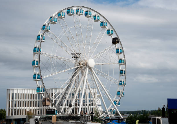 istock Large ferris wheel rotating under cloudy sky on waterfront. Helsinki Finland 2172690890