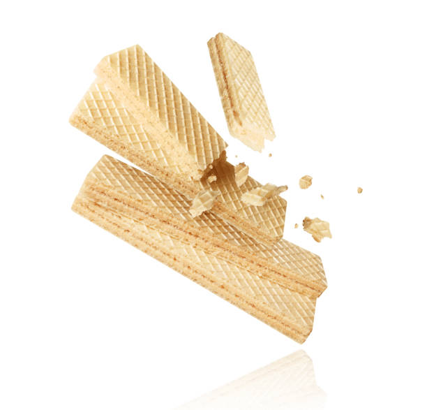 istock Crispy waffles crushed in the air close-up isolated on white background 2172697697