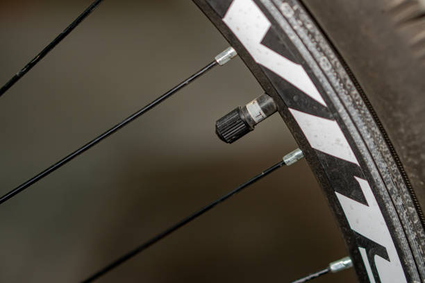 istock A valve with a cap on a bicycle wheel, close-up 2172702252