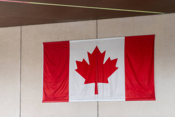 istock Canadian flag hanging on a wall 2172707027
