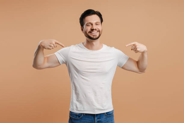 istock Handsome man pointing at himself with confident smile on beige background 2172707776