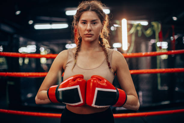 istock Resolute female boxer prepares with red gloves. 2172709719
