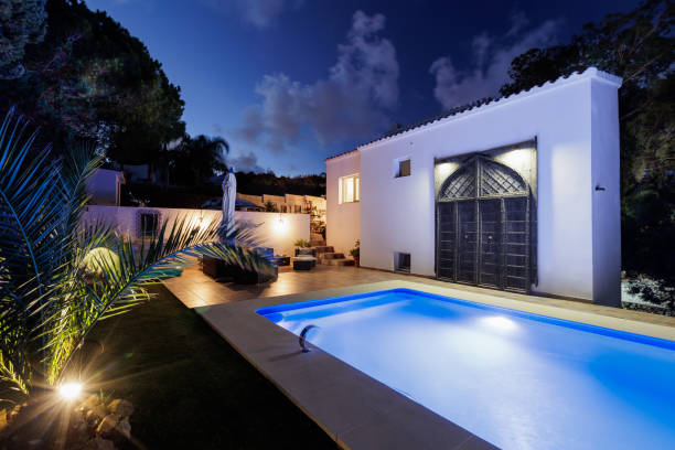 istock Cozy courtyard with pool at night. 2172711645