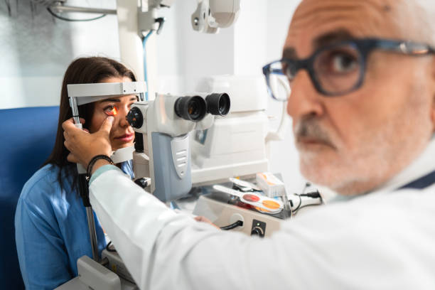 istock Ophthalmologist using slit lamp examining patient's eye in modern clinic 2172714918