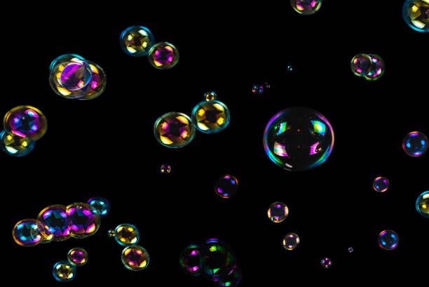 istock Soap bubbles isolated on a black background 2172723518