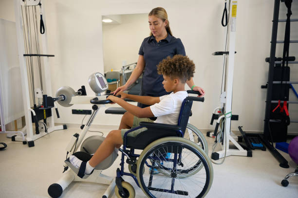 istock Young patient performs upper body exercises in a wheelchair 2172723730