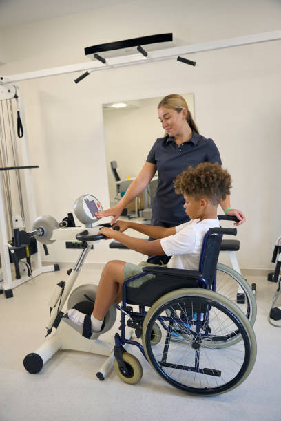 istock Female physiotherapist assists patient in their exercise routine 2172723742