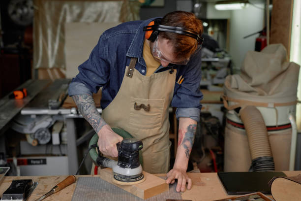 istock Concentrating on Woodworking in Artisan Workshop 2172724766