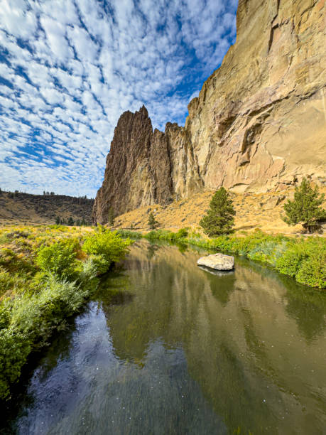 A beautiful scenic view of a calm river running through Smith Rock on a beautiful Spring day in Central Oregon.