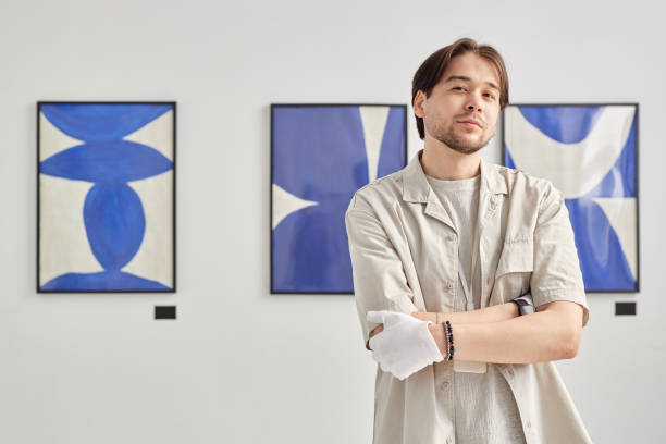 istock Man as Art Gallery Curator Looking at Camera 2172726825