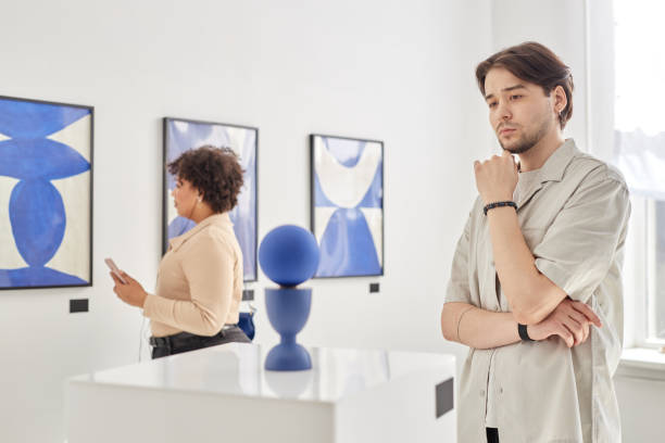 istock Man Looking at Art Sculpture Visiting Gallery 2172726860