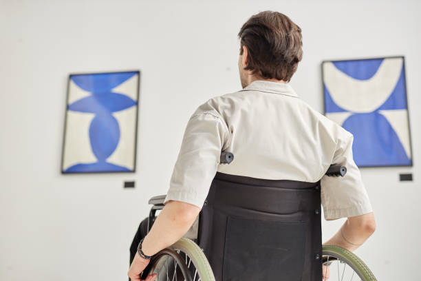 istock Back View of Man Visiting Accessible Art Gallery 2172726942
