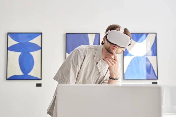 istock Man Looking at VR Art 2172727052