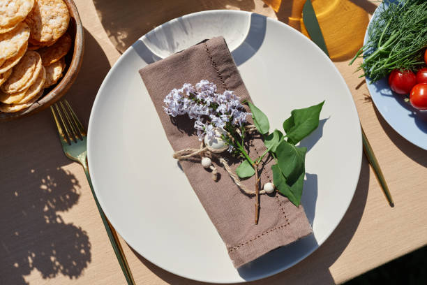 istock Elegant Dining Table Setting with Floral Napkin Decor 2172727551
