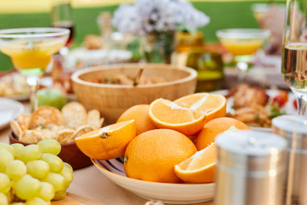 istock Fresh Oranges and Festive Table Setting at Outdoor Gathering 2172727764