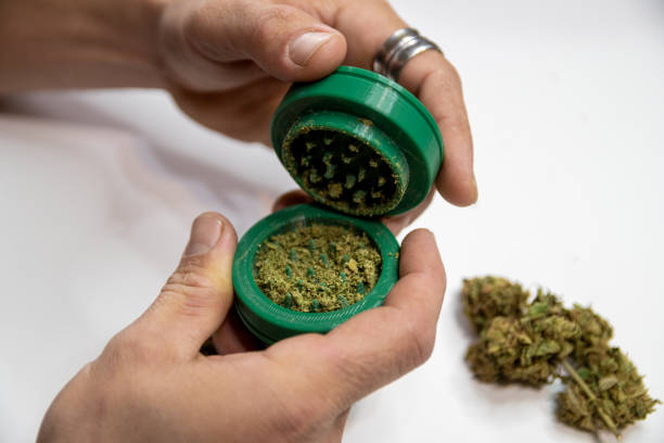 istock Ground cannabis, to roll a marijuana joint 2172728088
