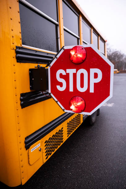 istock School bus stop sign Flashing 2172736602