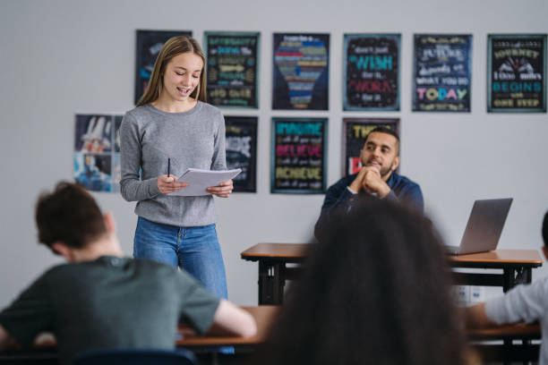 istock Middle school girl presents to class 2172736761