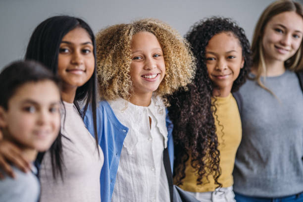 istock Junior high students stands in a line and smiles 2172736797