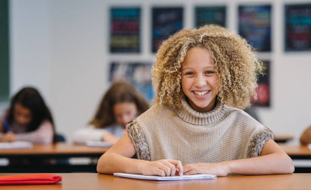 istock Confident elementary age girl in her classroom 2172736831