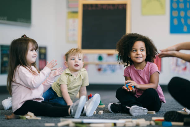 istock Preschool students play together in their classroom 2172736840