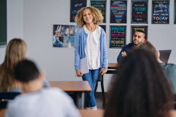 istock Multiracial student reads a poem for her class 2172736888