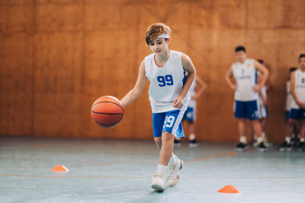 istock Child practicing with a basketball 2172744368