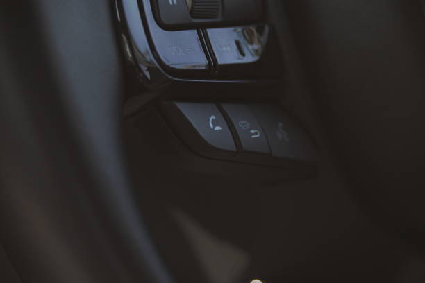 istock interior view of car with black leather, close up steering wheel with button 2172746028