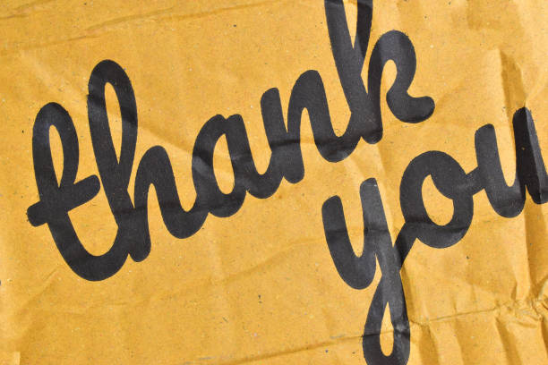 istock thank you wording on cardboard box texture background 2172747360