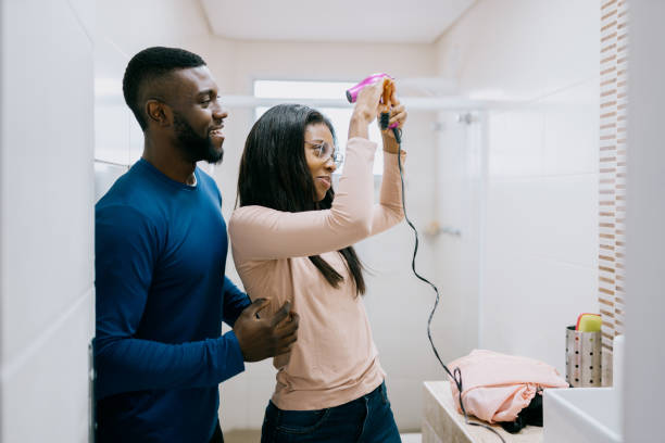istock Couple getting ready to go out in the bathroom 2172747662