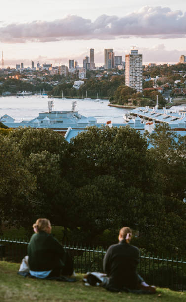 Sydney,New South Wales, Australia, September 3,2024: Locals and tourists are enjoying the sunset at Observatory Hill Park in Sydney. Sydney city is known for its well preserved parks on every street at downtown.