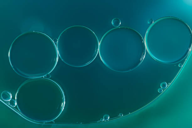 istock Oil drops floating on water surface . 2172748667