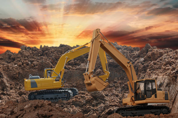 istock Two Excavator digging the soil In the construction site . 2172749011