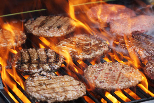 istock barbecue grill cooking burger steak on the fire 2172750625