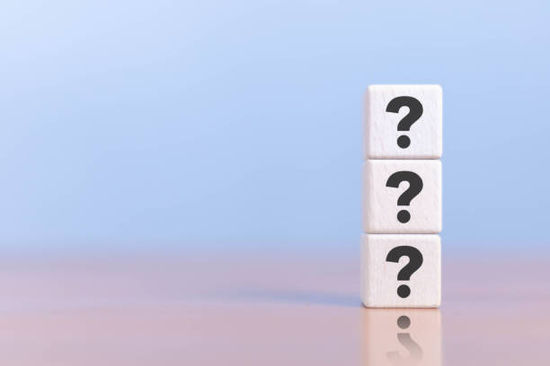 istock This image shows a man holding an icon, a question mark on a wooden cube. 2172753569
