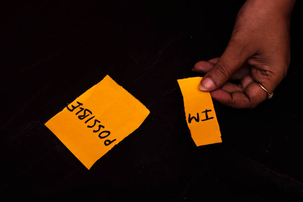 istock Woman Changing Impossible to I'm Possible on Yellow Note for Motivation Concept 2172755356