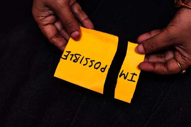 istock Woman Changing Impossible to I'm Possible on Yellow Note for Motivation Concept 2172755463