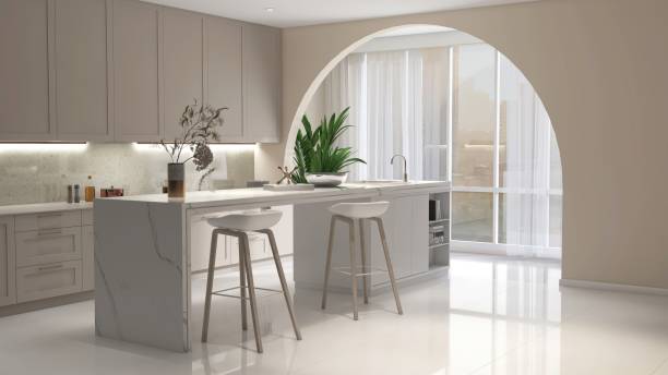 istock White marble kitchen island in modern, luxury kitchen with beige built in cabinet, cupboard in sunlight from arch window to cityscape view for interior design decoration, product background 3D 2172756534