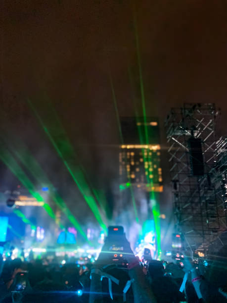 People streaming and dancing at a concert