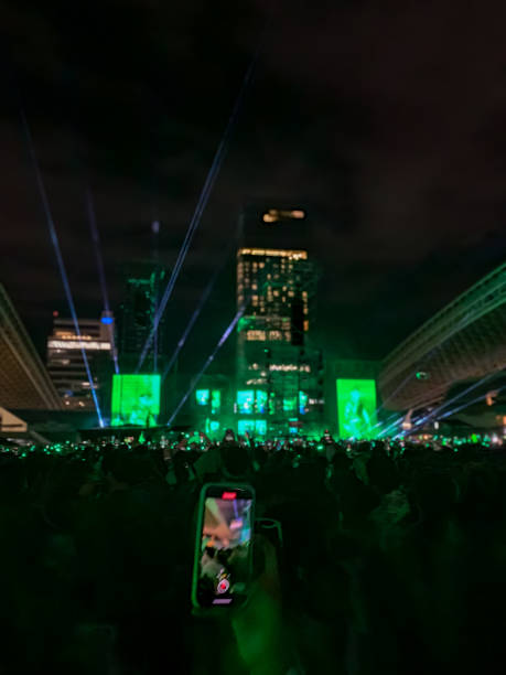 People streaming and dancing at a concert